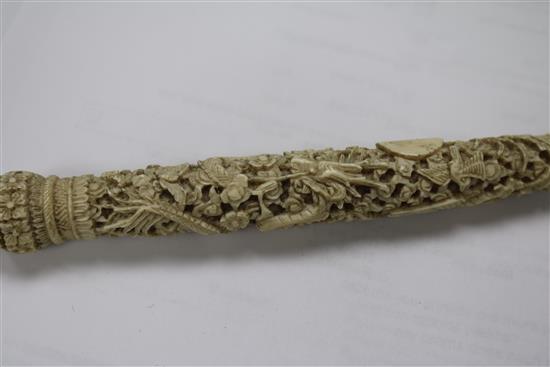 A Chinese ivory carved card case and two parasol handles